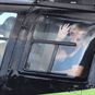 waving from helicopter